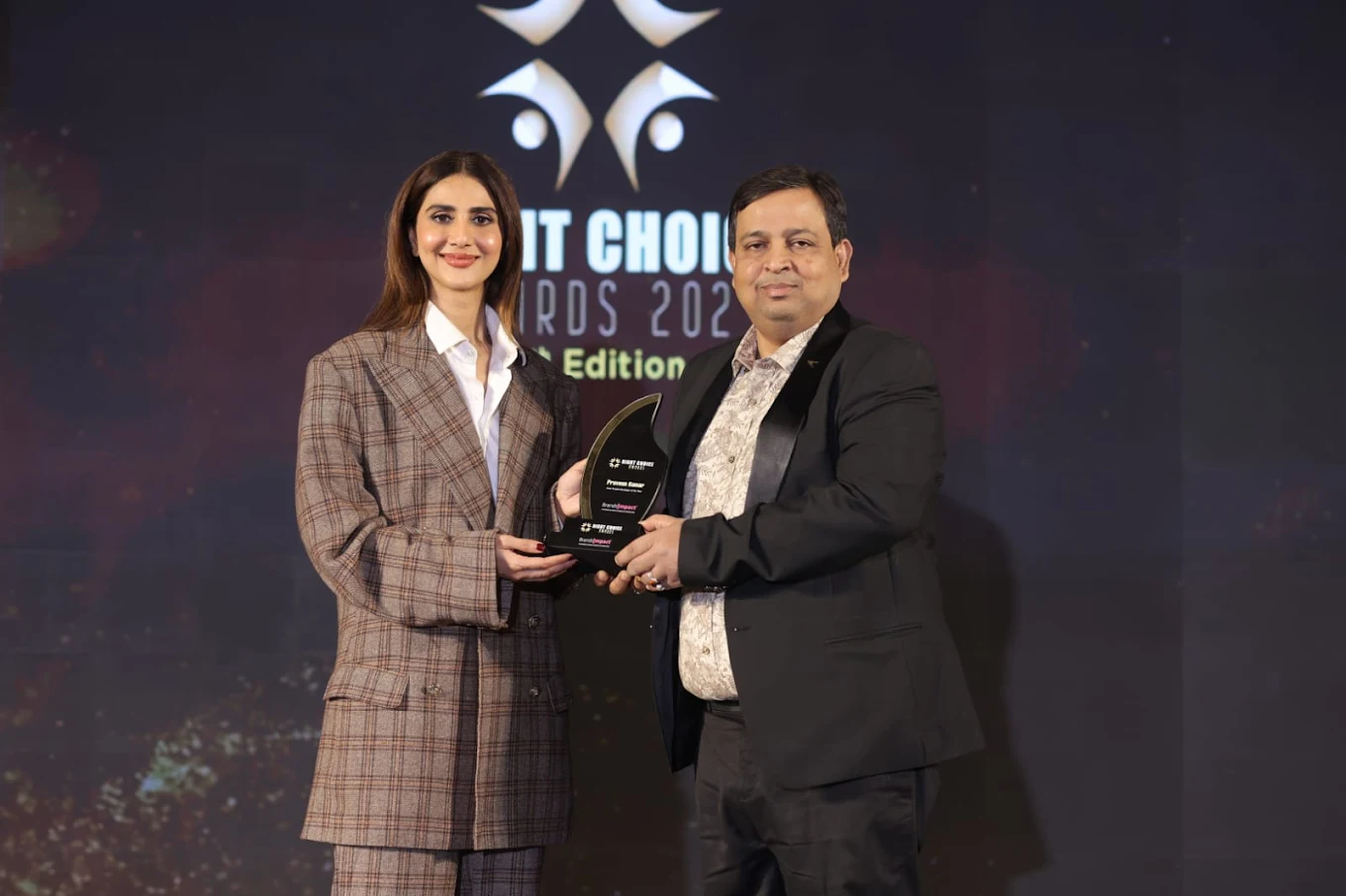 Astrologer Praveen Kumar receiving Best Choice Awards 2024